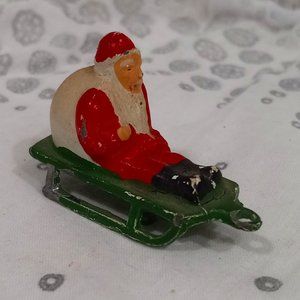Vintage Miniature Japan Metal Santa on Sled Figurine